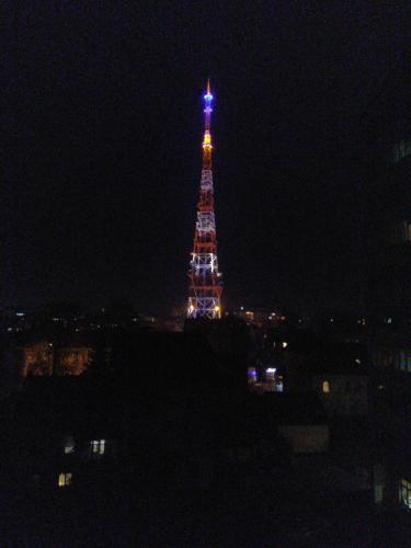 a lit up eiffel tower at night at Home in Center with jacuzzi in Ivano-Frankivsʼk
