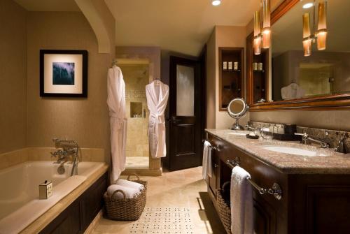 a bathroom with two sinks and a tub and a shower at Madeline Hotel and Residences, Auberge Resorts Collection in Telluride