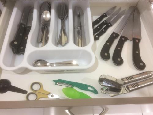 a drawer filled with lots of kitchen utensils at The Meadows Villa in Christchurch