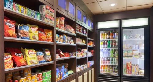 a grocery store aisle with lots of food and drinks at Country Inn & Suites by Radisson, Austin North Pflugerville , TX in Round Rock