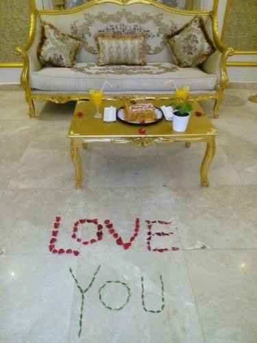 a living room with a table with the words thank you at Golden dune Hotel Services-Al Fayhaa in Riyadh