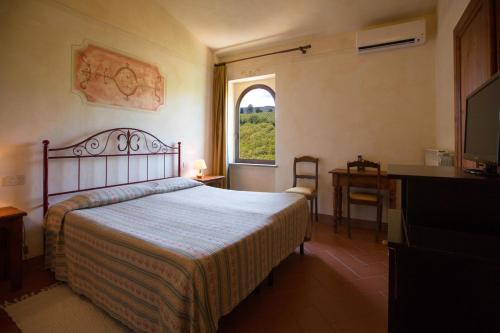 Postel nebo postele na pokoji v ubytování Rocca degli Olivi