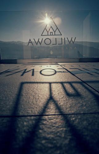 a view of a view of the al awin sign in front of a building at Apartamenty Willowa in Szczyrk