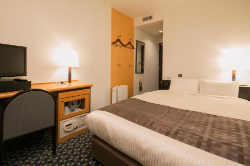 Un ou plusieurs lits dans un hébergement de l'établissement Premier Hotel-CABIN-Sapporo