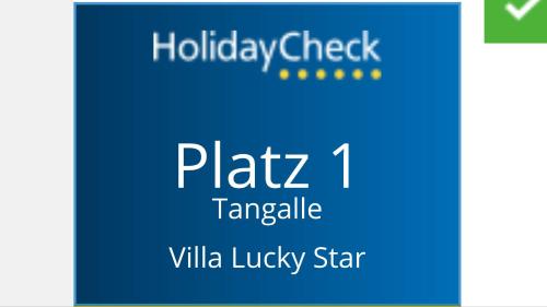 a blue sign with the words platz taylorille at Villa Lucky Star in Tangalle
