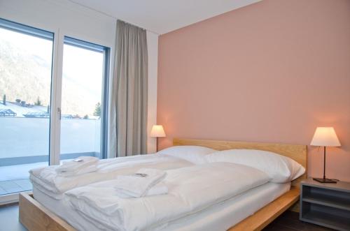 Ένα ή περισσότερα κρεβάτια σε δωμάτιο στο Apartment Anemone - GRIWA RENT AG