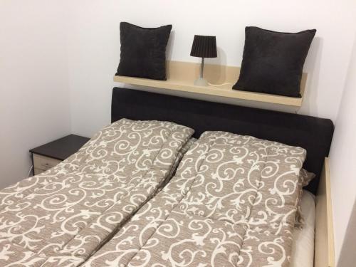 Кровать или кровати в номере Apartment Lazic vila Suri