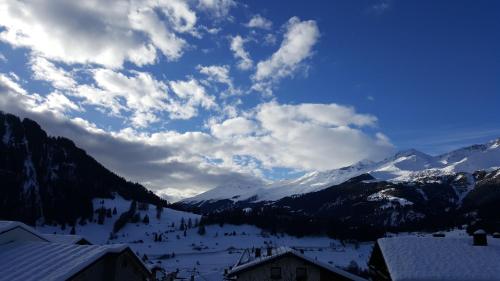 a view of a snowy mountain range with snow covered mountains at Haus Brigitte in Nauders