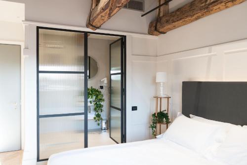 Postel nebo postele na pokoji v ubytování Hotel 5 Colonne
