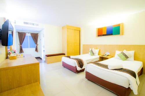 Ένα ή περισσότερα κρεβάτια σε δωμάτιο στο The Lephant Hotel