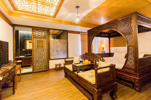 a large room with a bed and a table at 日光微醺 in Luodong