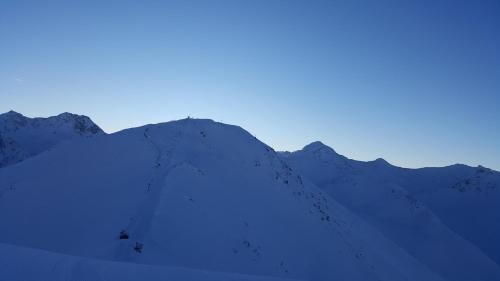 a snow covered mountain with the sky in the background at Haus Brigitte in Nauders