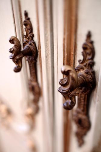 a close up of a wooden door with patterns on it at Hotel Grand'Italia in Padova