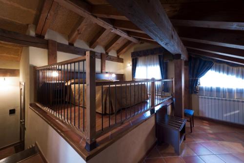 a bedroom with a bed in a room with wooden ceilings at Hotel Cà Fiore in Bardonecchia