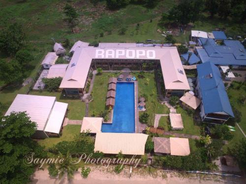 an aerial view of a house with a swimming pool at Rapopo Plantation Resort in Kokopo