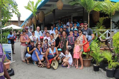 a large group of people posing for a picture at Rapopo Plantation Resort in Kokopo