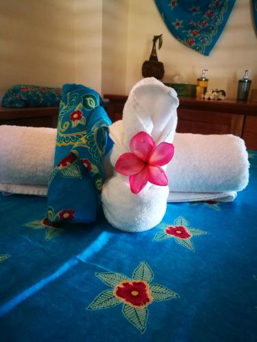 a towel animal sitting on top of a bed at Rapopo Plantation Resort in Kokopo