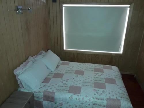 Postel nebo postele na pokoji v ubytování Cabaña Doña Maria