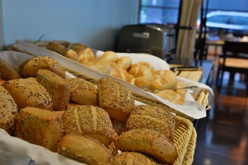 a bunch of different types of bread on display at Hotel Santo in Cologne