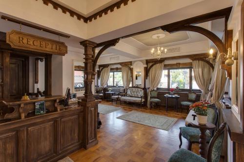 a large living room with wood paneling at Casa Din Bran - Inn Center in Bran