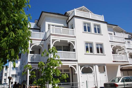 a white building with white balconies on it at "Villa Laetitia" - WG 15 - zentral, strandnah, 2 Balkone in Binz