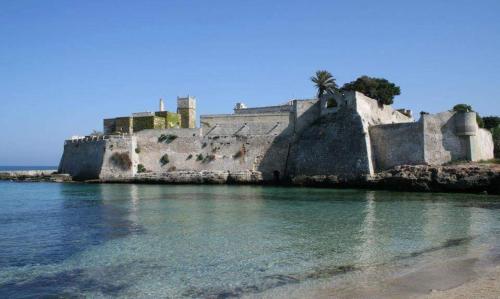 an old castle on the shore of the water at Il Porto Di Ciccia' in Monopoli