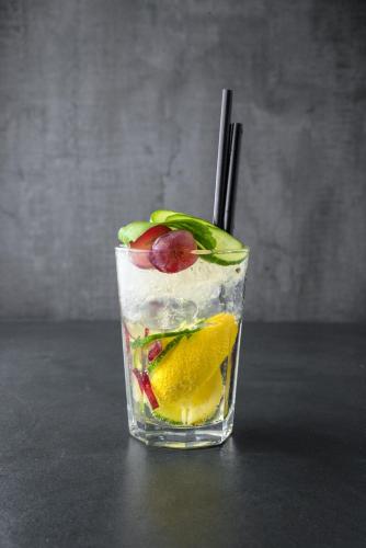 a drink with fruit and ice on a table at Aura Hotel Adults Only in Balatonfüred
