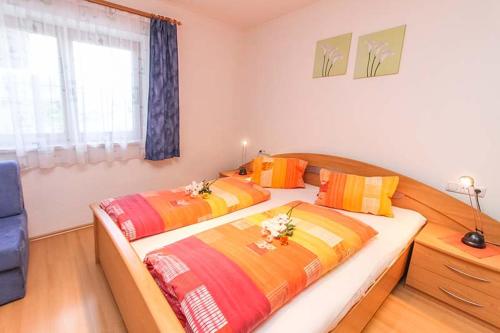 En eller flere senge i et værelse på Ferienwohnung Biechl-Hauser Doris