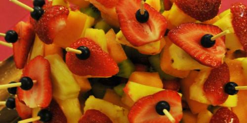 a pile of fruit in the shape of eyes and strawberries at Hotel Italia in Baselga di Pinè