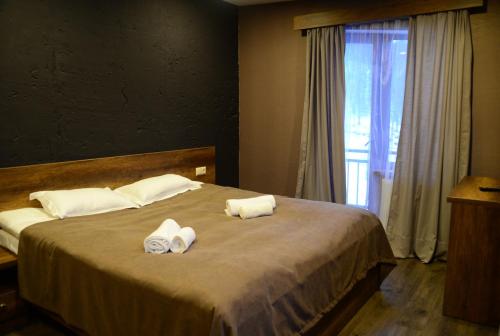 Кровать или кровати в номере Loft Hotel Bakuriani