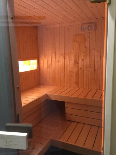 a wooden sauna with a bench in it at Hotel Royal in Tetovo