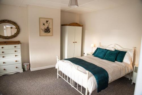 מיטה או מיטות בחדר ב-Barney's Lodge