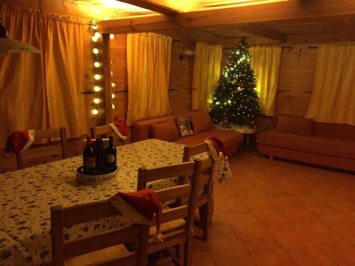 a living room with a christmas tree and a table at Chalupa Lužické hory in Dolní Světlá