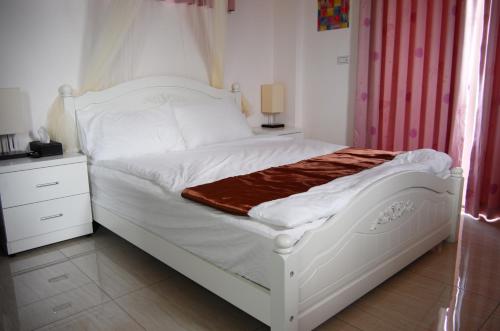 Łóżko lub łóżka w pokoju w obiekcie New Zhilan B&B