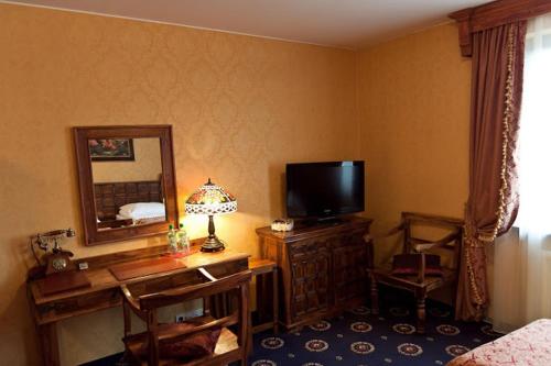 TV a/nebo společenská místnost v ubytování Hotel Zameczek