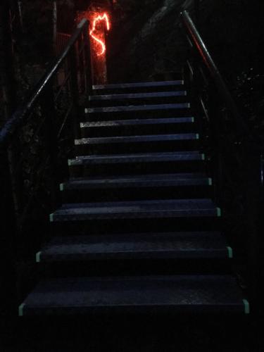 a set of stairs in the dark at night at Cabañas De Madera Y Bungalows - Gilmañas 3 in La Iruela