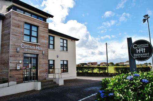 a building with a sign in front of it at Cromore Halt in Portstewart