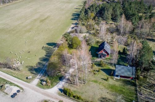 an aerial view of a house and a field at Holiday Home with Sauna in Kassari