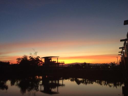 a view of a roller coaster at sunset at Rung ChiangRai Resort in Chiang Rai