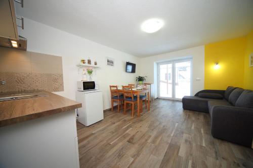 a living room with a couch and a table at Danijela & Gregor in Rateče