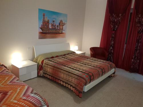 Postel nebo postele na pokoji v ubytování B&B Nonna Rosaria