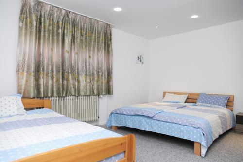 מיטה או מיטות בחדר ב-Charlotte Flat Heidelberg