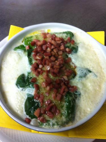 a plate of omelet with beans and broccoli at Hotel Preda Kulm in Bergün