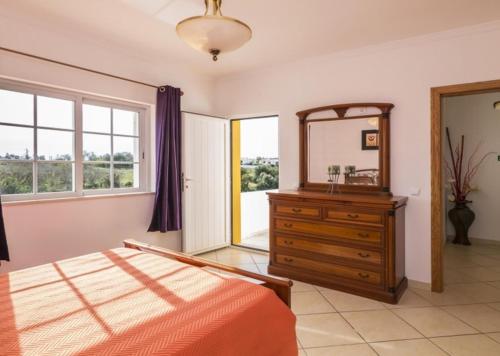 Llit o llits en una habitació de Villa Coelho