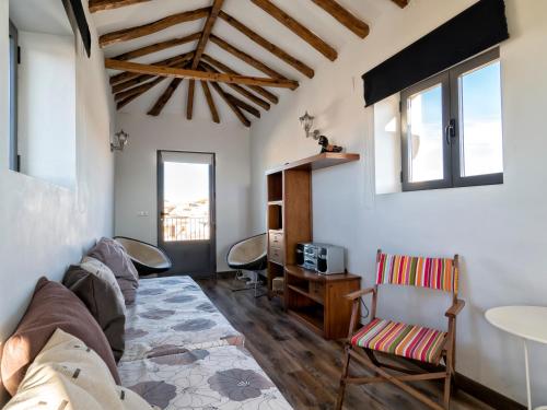 a living room with a couch and a table at Casona Del Buen Vivir in Camuñas