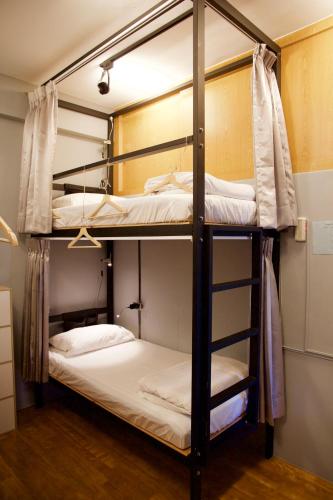 a couple of bunk beds in a room at Stay Liuqiu Diving Hostel in Xiaoliuqiu