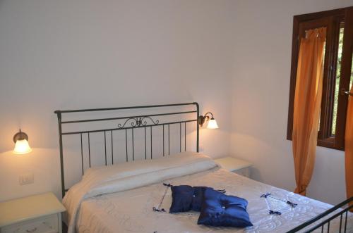 Säng eller sängar i ett rum på Residence Costa Del Turchese