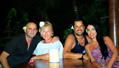 a group of people sitting at a table at Kubu Garden Suites & Villas Nusa Dua in Nusa Dua