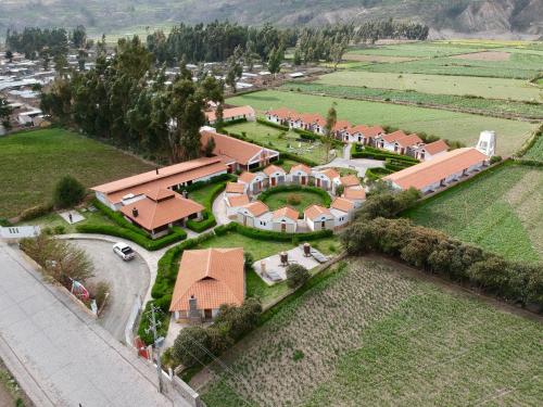 an aerial view of a large house with a garden at Casona Plaza Ecolodge Colca in Yanque