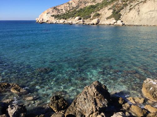 a body of water with rocks and the ocean at Beso Patara in Patara